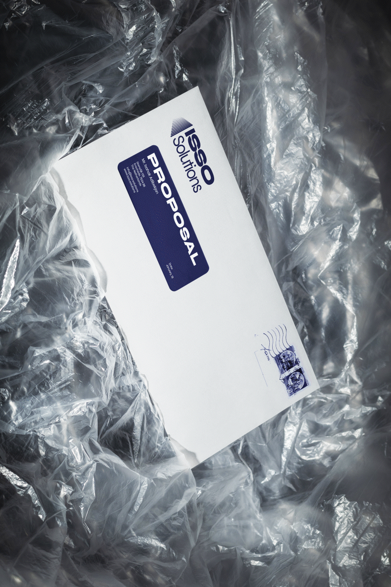 ISSO Solutions printed business proposal and invoice design on textured background with modern typography